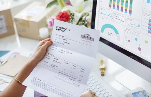 Woman reading electricity bill