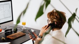 lady busy on the phone at work